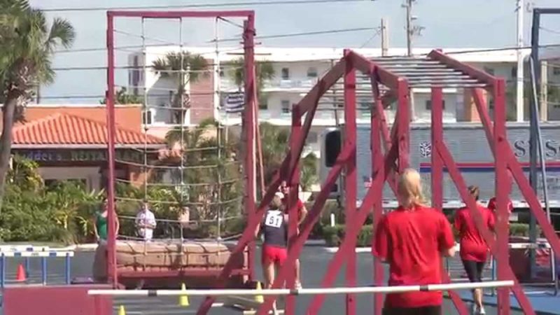 Tri-Fitness Athlete, Connie Knott runs the Obstacle Course.